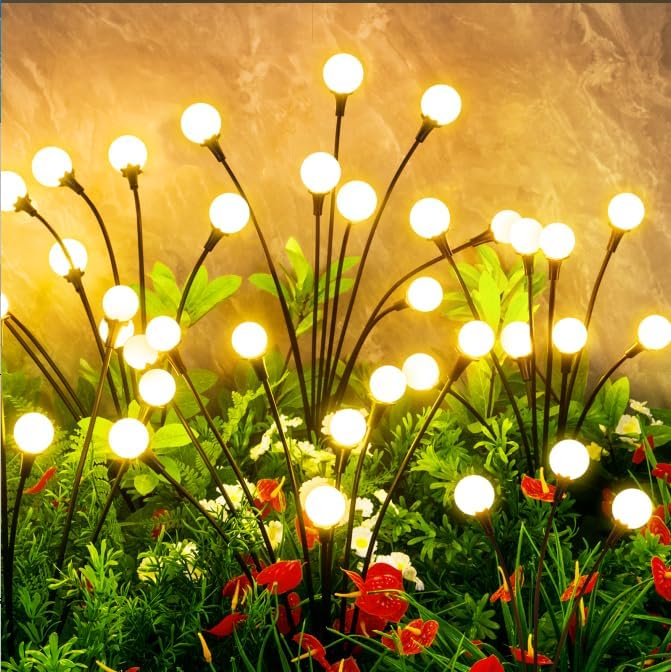 Solar-powered outdoor lights illuminating a campsite at night